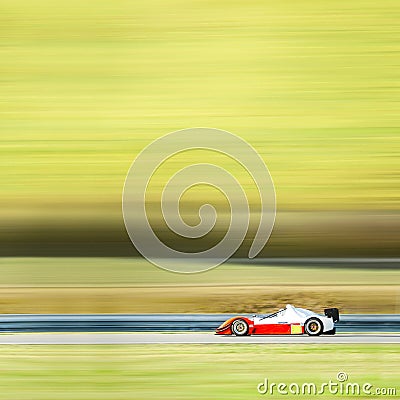 Formula one race car on speed track - motion blur background wit Stock Photo