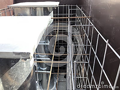 Formwork and reinforcement of road bollard foundation Stock Photo