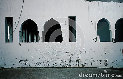 Forsaken house with windows in arabian style Stock Photo
