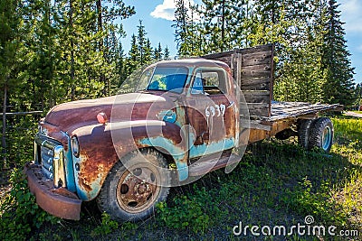 Fort Fraser, British Columbia, Canada. Old rusted car in the forest Editorial Stock Photo