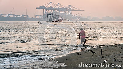 Fort Kochi fisherman throwing his net into the water Editorial Stock Photo