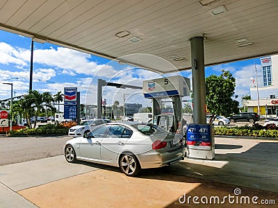 Fort Lauderdale - December 1, 2019: People fill up their cars at Chevron gas station at Fort Lauderdale Editorial Stock Photo