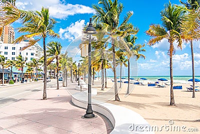 Fort Lauderdale, Florida, USA - September 20, 2019: Seafront beach promenade with palm trees on a sunny day in Fort Editorial Stock Photo