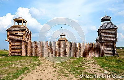 Photo of fort with wooden stockade and four towers. Stock Photo