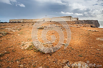 Forteress of Sagres with dramatic cloudy sky Stock Photo