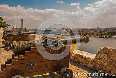 Fortaleza de San Carlos de La Cabana, Fort of Saint Charles entrance. Landscape with city views, guns are at the old fortress. Cub Editorial Stock Photo