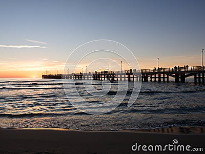 Forte dei Marmi`s pier Pleople walking while sun is setting Stock Photo
