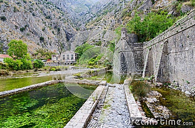 Fortress wall of Bastion Riva near river Shkurda, Old town of Kotor Editorial Stock Photo