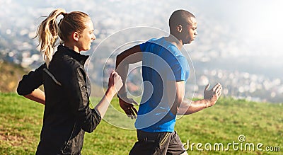 We found running to be the ultimate therapy. a sporty couple out running on a mountain road. Stock Photo