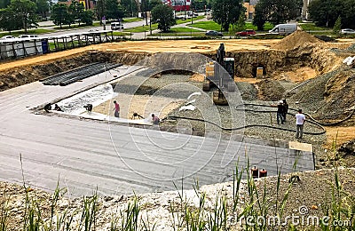 Foundation ditch with construction machinery at construction sit Editorial Stock Photo