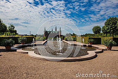 A fountain in the beautiful parkland around the great castle Frederiksborg Castle in Denmark Stock Photo