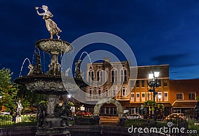 Fountain in Bowling Green`s town square during blue hour Editorial Stock Photo