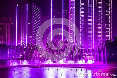 Fountain, building with Ultra Violet decorative lights Stock Photo