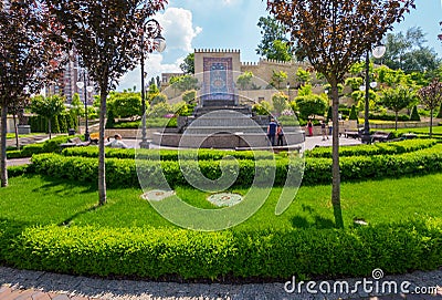 A fountain cascade near the wall with a mosaic in the beautiful green square of Heydar Aliyev. Kiev. Ukraine Editorial Stock Photo
