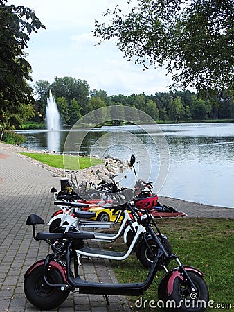 Lake, tress, fountain and children scooters, Lithuania Stock Photo