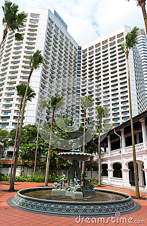 Fountain in classical style and modern building Stock Photo