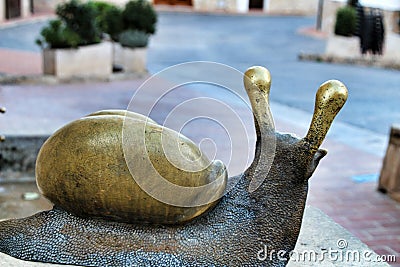 Fountain with decorative metal snails in Carricola square Editorial Stock Photo