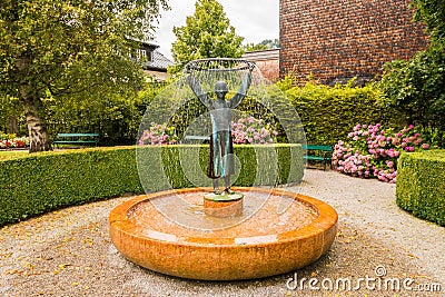 Fountain depicting Mozart`s mother Anna Maria Mozart as a small girl, St.Gilgen, Austria Editorial Stock Photo