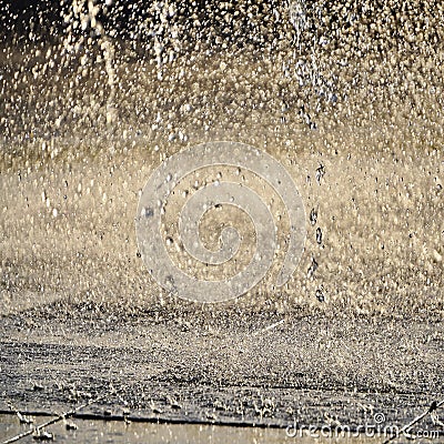 Fountain, drops of water flying in the air. screensaver, background, copy space, texture. light of the sun drops of different Stock Photo