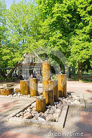Fountain in front of the cafe in the city park of Nordhorn Stock Photo
