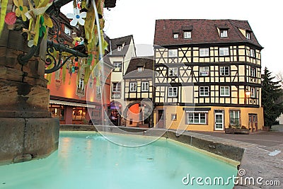 Fountain and half-timbered house in Colmar Editorial Stock Photo