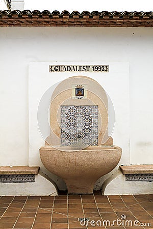 Fountain made of carved stone in Guadalest Editorial Stock Photo