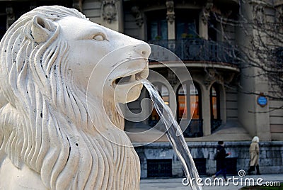 Fountain with marble lion spouting water with Bilbao city background Stock Photo
