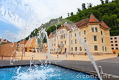 Fountain and pedestrian street in Vaduz , Liechtenstein Stock Photo