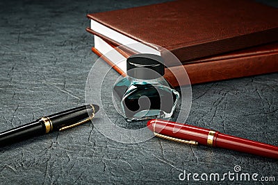 Fountain pens with ink and organizers Stock Photo