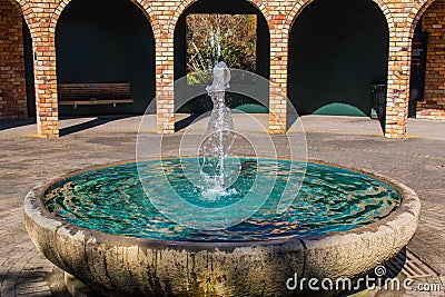 Fountain with pillars in the back gorund Stock Photo
