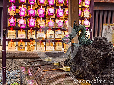 Fountain for religious washing in a Japanese Temple - ritual purification Editorial Stock Photo