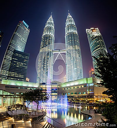 Fountain show at night in front of Petronas Twin Towers Editorial Stock Photo