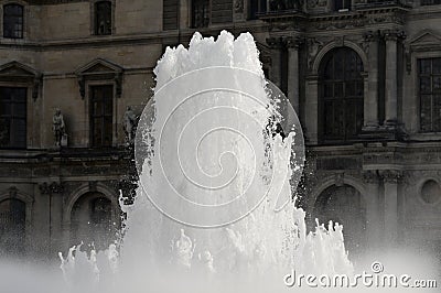 Fountain in the square in front of the Louvre Editorial Stock Photo