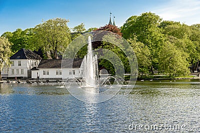 A fountain and Stavanger Cathedral school at Byparken park in Stavanger city downtown Editorial Stock Photo