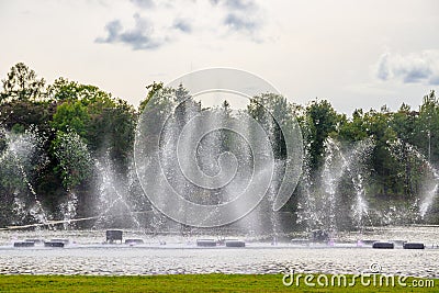 Fountain on the water. Water show. Fountain on the lake in the park Stock Photo