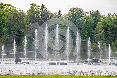 Fountain on the water. Water show. Fountain on the lake in the park Stock Photo