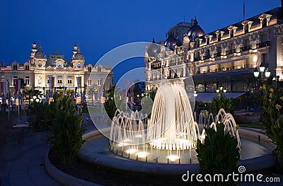 Fountains at dusk in Casino square in Monaco Stock Photo