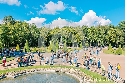 Fountains of Peterhof. View of Roman fountains in Lower park of Peterhof. Beautiful garden with green grass, shrubs and Editorial Stock Photo
