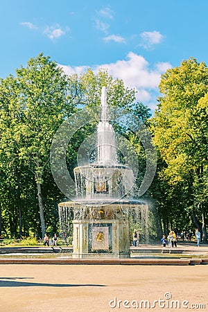 Fountains of Peterhof. View of Roman fountains in Lower park of Peterhof. Beautiful garden with green grass, shrubs and Editorial Stock Photo