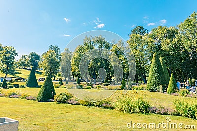 Fountains of Peterhof. View of Roman fountains in Lower park of Peterhof. Beautiful garden with green grass, shrubs and Editorial Stock Photo