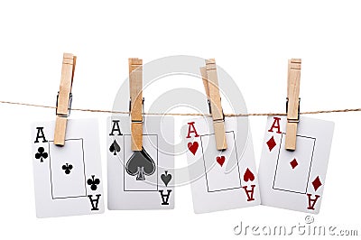 Four aces hanging from clothes pegs on a clothes l Stock Photo