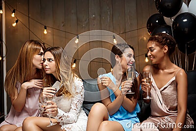 Four beautiful girls resting at party. Stock Photo