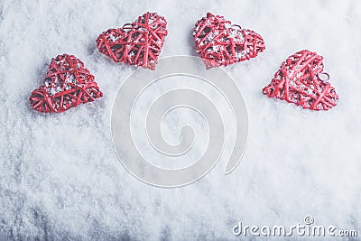 Four beautiful romantic vintage hearts on a white frosty snow background. Love and St. Valentines Day concept. Stock Photo