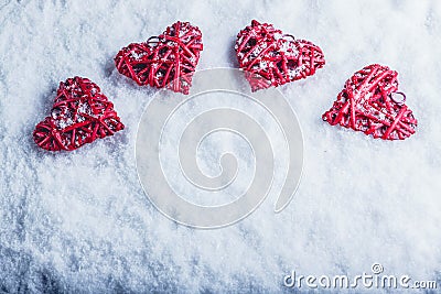 Four beautiful romantic vintage hearts on a white frosty snow background. Love and St. Valentines Day concept. Stock Photo