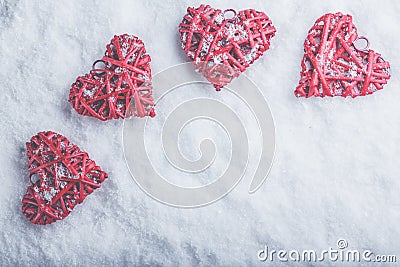 Four beautiful romantic vintage hearts on a white frosty snow background. Love and St. Valentines Day concept. Stock Photo