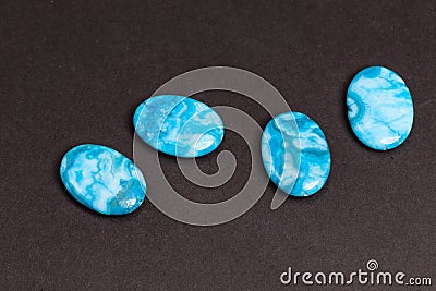 Four blue flat buttons used to create jewelry Stock Photo