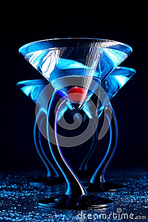 Four blue martini with cherry Stock Photo