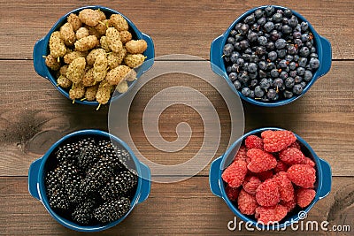 Four bowls with berries Stock Photo