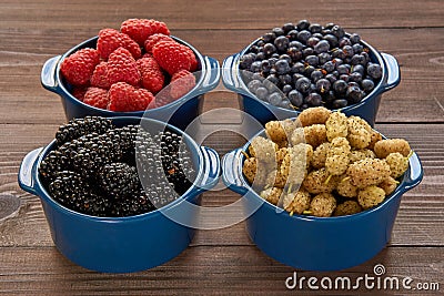 Four bowls with berries Stock Photo