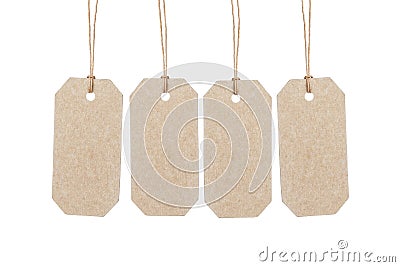 Four brown tags hanging on ropes Stock Photo